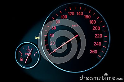 Car instrument panel, dashboard closeup with visible speedometer and fuel level. Modern car interior details. Stock Photo
