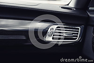 Car interior with close-up of ventilation system holes and air conditioning. Concept wallpaper for auto air conditioning Stock Photo