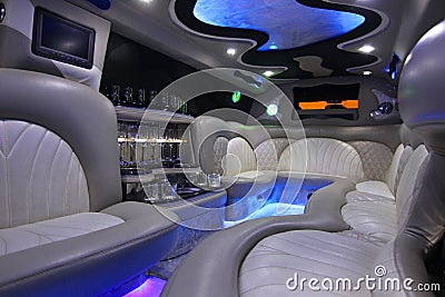 Car interior with comfortable sofas, bar and lights Stock Photo