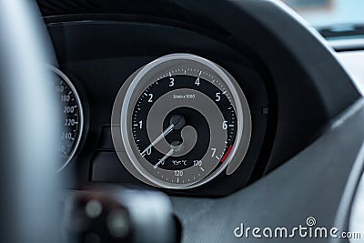 Car interior. Modern car speedometer and dashboard. Luxurious car instrument cluster. Stock Photo