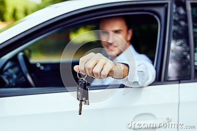 Car keys in the hand of a young driver Stock Photo