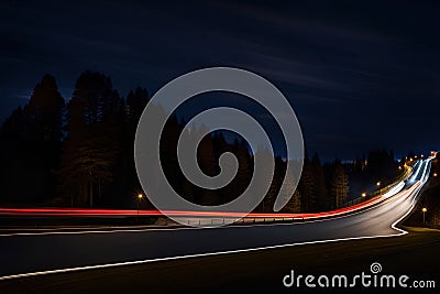 Car light trails on the road at night. Long exposure photo. Stock Photo
