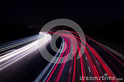 Car lights on highway with a dark night Stock Photo