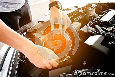 Car maintenance technician He is checking the auto engine, car inspection center. Stock Photo