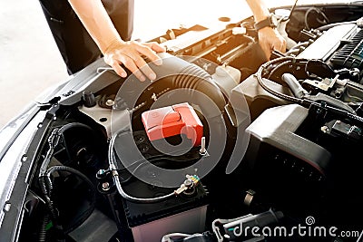 Car maintenance technician He is checking the auto engine, car inspection center Stock Photo