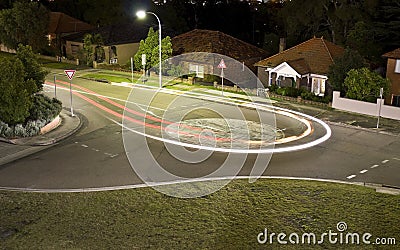 A car making a U-turn light trail Stock Photo