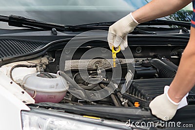 The car master checks the engine oil level Stock Photo