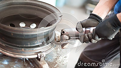 Auto mechanic vulcanizer using grinding wheel in auto vulcanizing service Stock Photo