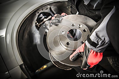 Car Mechanic with Brake Disc Stock Photo