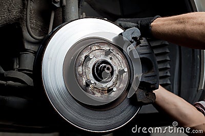 Car mechanic repair brake pads Stock Photo