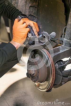 Car mechanic repair brake pads close up. Stock Photo