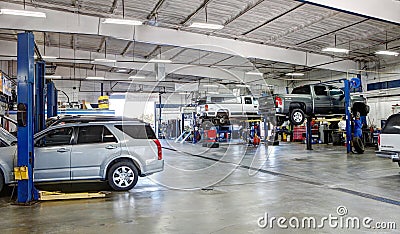 Mechanics in a car repair shop. Editorial Stock Photo