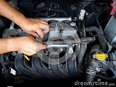 Car mechanic working in auto repair service Stock Photo