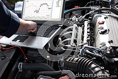 Car mechanic working in auto repair service. Stock Photo