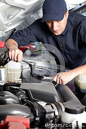 Car mechanic working in auto repair service. Stock Photo