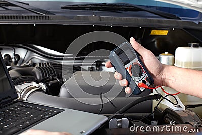 Car mechanic working in auto repair service. Stock Photo