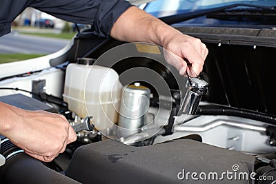 Car mechanic working in auto repair service. Stock Photo