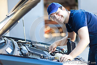 Car mechanic working in auto repair service. Stock Photo