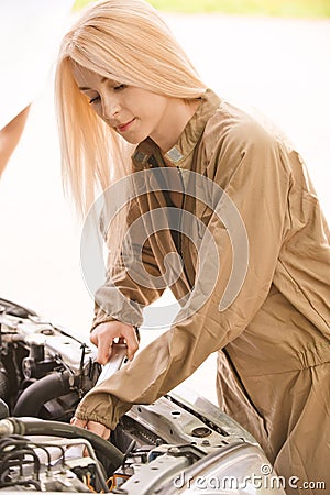 Car mechanician repairs engine Stock Photo