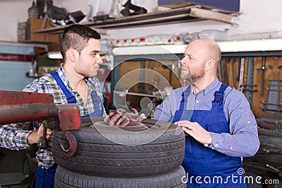 Car mechanics working at carshop Stock Photo