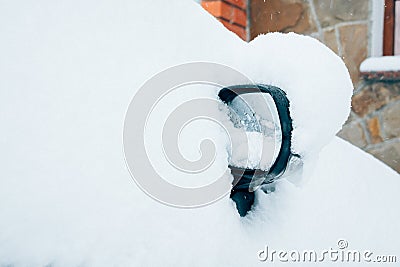 Car mirror in snow. Frozen, snow covered passenger car mirror Stock Photo