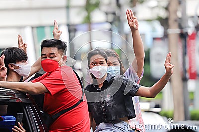 `Car Mob` Protesters a three finger salute to show symbolic gestures between driving vehicles and honk. Editorial Stock Photo