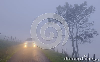 Car on mount Jaizkibel. Car with fog lights on mount Jaizkibel, Euskadi Stock Photo