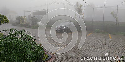 Car at mountainious fog Editorial Stock Photo