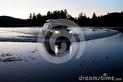 Car moves to fording the river in Mongolia Stock Photo