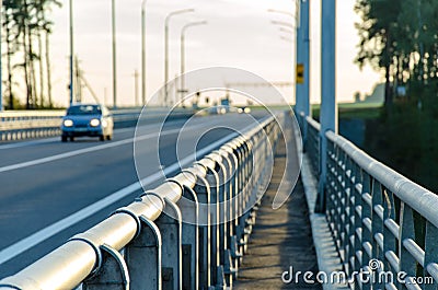 The car is not in focus on the overpass. hitchhiking tourism Stock Photo