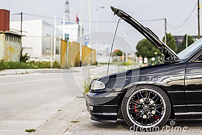 Car with open hood Stock Photo