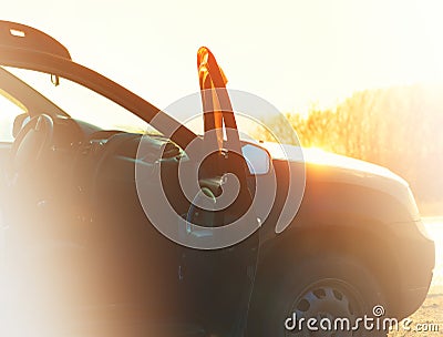 Car with opened door during sunset background Stock Photo