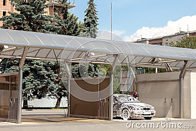 Car in outdoors self-service car wash, car in foam, toned Editorial Stock Photo