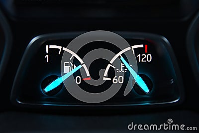 Car panel with fuel level and temperature arrows Stock Photo