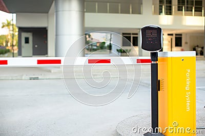 Car park automatic entry system. Security system for building access - barrier gate stop with toll booth, traffic cones Stock Photo