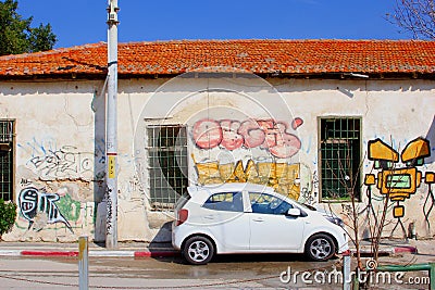 Car parked mural art buildings, Neve Tzedek, Tel Aviv Editorial Stock Photo