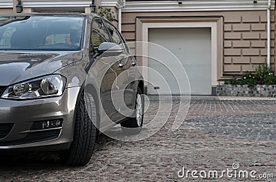 Car parked near garage Stock Photo