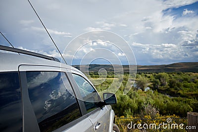 Car parked overlooking the Hams Fork River Stock Photo