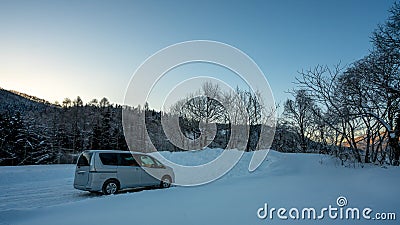 Car Parking On Snow Landscape Stock Photo