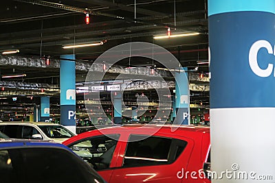 Car parking under a shopping center in St. Petersburg. lighting and ventilation system in the underground parking Editorial Stock Photo