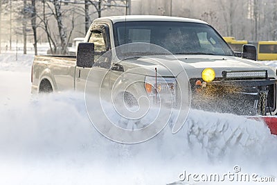 Car pickup cleaned from snow by a snowplough during wintertime Stock Photo