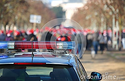 Car of the police during the march with the rioters Stock Photo