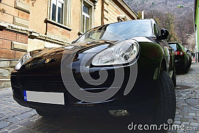 Car Porsche is parked on narrow street Editorial Stock Photo