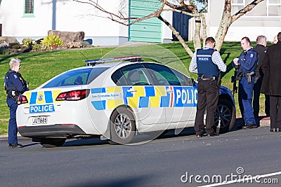 Armed members of the New Zealand police force around police car Editorial Stock Photo