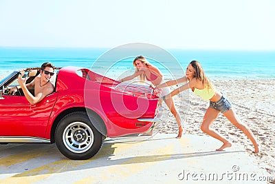 Car pushing teen girls humor funny guy driving Stock Photo