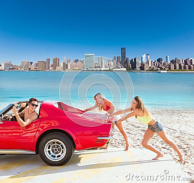 Car pushing teen girls humor funny guy driving Stock Photo