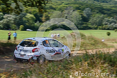 Car racing at the annual rallying event in Iasi at green Dobrovat forest road Editorial Stock Photo
