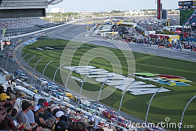 Car racing and fans. Competition at International speedway. Editorial Stock Photo