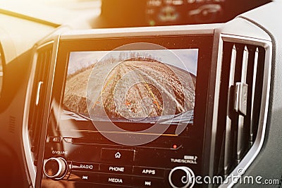 car rear view system monitor reverse video camera screen. modern digital technology equipment on automobile dash Stock Photo