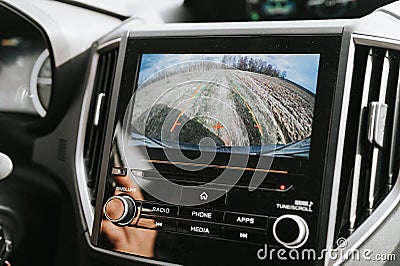 car rear view system monitor reverse video camera screen. modern digital technology equipment on automobile dash Stock Photo